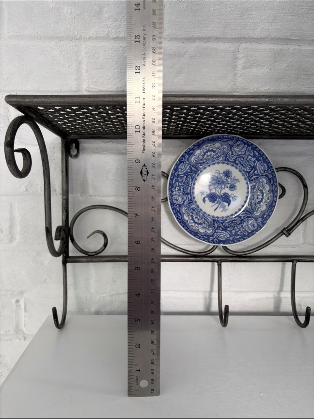 Black Wrought Iron Wall Shelf with Hooks and Decorative Blue Plate - Picture 7 of 12